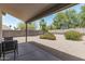 Spacious backyard patio featuring neutral tones, an outdoor seating area, and desert landscaping at 1016 E Utopia Rd, Phoenix, AZ 85024