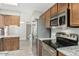 Well-equipped kitchen with stainless steel appliances and granite countertops at 1016 E Utopia Rd, Phoenix, AZ 85024