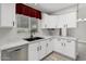 Bright kitchen featuring white cabinets, granite countertops, stainless steel dishwasher, and a modern sink at 1016 E Utopia Rd, Phoenix, AZ 85024