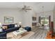 Bright living room with vaulted ceilings, modern furnishings, and an adjacent dining area at 1016 E Utopia Rd, Phoenix, AZ 85024
