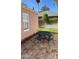 Serene backyard oasis with a brick patio, outdoor seating, and privacy fencing at 102 W Washington Ave, Gilbert, AZ 85233