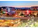 Sunset view of vibrant downtown Gilbert, Arizona, showcasing modern architecture and inviting outdoor spaces at 102 W Washington Ave, Gilbert, AZ 85233