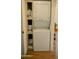Convenient laundry area features a stacked washer and dryer with built in storage at 102 W Washington Ave, Gilbert, AZ 85233