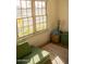Cozy room area with bright natural lighting, large windows, and comfortable seating with an adjacent basket at 102 W Washington Ave, Gilbert, AZ 85233
