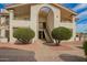 Exterior view of building entrance featuring well-maintained landscaping at 10610 S 48Th St # 2001, Phoenix, AZ 85044