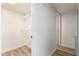 Walk-in closet with adjustable shelving and wood-look flooring offers ample storage space at 10610 S 48Th St # 2001, Phoenix, AZ 85044