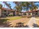 A well-maintained two-story building, featuring a lush lawn, mature shade trees, and easy access at 10610 S 48Th St # 2001, Phoenix, AZ 85044