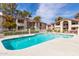 Community pool provides refreshing relaxation, framed by well-maintained residential buildings and sunny skies at 10610 S 48Th St # 2001, Phoenix, AZ 85044