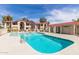 Community pool offers crystal-clear water and seating areas, set against a backdrop of well-maintained buildings at 10610 S 48Th St # 2001, Phoenix, AZ 85044