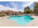 Community pool offers refreshing relaxation, framed by well-maintained cabana and sunny skies at 10610 S 48Th St # 2001, Phoenix, AZ 85044