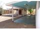 Backyard featuring large covered patio, gravel and rock at 10621 N 115Th Ave, Youngtown, AZ 85363