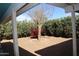 Backyard featuring mature desert landscaping and gravel ground cover at 10621 N 115Th Ave, Youngtown, AZ 85363