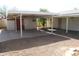 View of covered back patio and gravel yard space at 10621 N 115Th Ave, Youngtown, AZ 85363