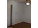 A bedroom with a ceiling fan, neutral walls, and wood-look flooring at 10621 N 115Th Ave, Youngtown, AZ 85363