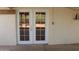 Double doors lead to backyard, offering natural light and outdoor access at 10621 N 115Th Ave, Youngtown, AZ 85363