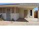 Exterior view showing a covered carport and secure entry doors at 10621 N 115Th Ave, Youngtown, AZ 85363