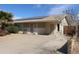 Charming single-story home featuring desert landscaping, a covered porch, and solar panels on the roof at 10621 N 115Th Ave, Youngtown, AZ 85363