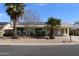 Inviting single-story home featuring desert landscaping, solar panels, and a welcoming facade at 10621 N 115Th Ave, Youngtown, AZ 85363