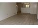 Bright, tiled living room provides open access to the kitchen and lots of space at 10621 N 115Th Ave, Youngtown, AZ 85363