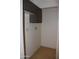 A small pantry with tiled floors, upper cabinets, and ample space at 10621 N 115Th Ave, Youngtown, AZ 85363