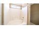 Bathroom alcove tub with white tiles, window, and shower head at 10851 E Clovis Ave, Mesa, AZ 85208