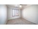 Neutral bedroom with carpet flooring, ceiling fan, and window with light-filtering shutters at 10851 E Clovis Ave, Mesa, AZ 85208