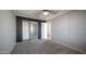 Bedroom featuring carpet floors, a ceiling fan, and a closet with sliding doors at 10851 E Clovis Ave, Mesa, AZ 85208