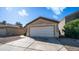Charming single-story home with a two-car garage, low maintenance landscaping, and a cozy facade at 10851 E Clovis Ave, Mesa, AZ 85208