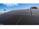 View of solar panels installed on home's roof at 10851 E Clovis Ave, Mesa, AZ 85208