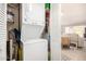 Efficient stacked washer and dryer in hall laundry closet near living space at 10854 N Fairway E Ct, Sun City, AZ 85351