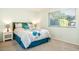 Serene bedroom with soft lighting and a comfortable queen bed at 10922 W Peoria Ave, Sun City, AZ 85351