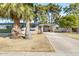 Quaint single-Gathering home with desert landscaping, covered parking, and light-colored exterior paint at 10922 W Peoria Ave, Sun City, AZ 85351