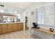 Bright, open kitchen space with ample counter space, storage, and tile flooring at 10922 W Peoria Ave, Sun City, AZ 85351