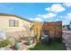 Serene backyard features decorative privacy screen, potted plants, and an artificial lawn area at 11596 W Sierra Dawn Blvd # 278, Surprise, AZ 85378