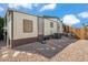 Exterior shot of home featuring backyard with desert landscaping and a shade structure at 11596 W Sierra Dawn Blvd # 278, Surprise, AZ 85378