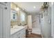 Bathroom boasts a single sink vanity with a framed mirror, complemented by a marble-tiled walk-in shower at 11596 W Sierra Dawn Blvd # 278, Surprise, AZ 85378