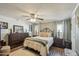 Cozy bedroom features a comfortable bed, matching nightstands, and a ceiling fan at 11596 W Sierra Dawn Blvd # 278, Surprise, AZ 85378