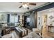 Comfortable living room with a large couch, decorative pillows, and large entertainment center at 11596 W Sierra Dawn Blvd # 278, Surprise, AZ 85378
