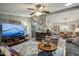 Inviting living room with a large TV, cozy seating, and open floor plan at 11596 W Sierra Dawn Blvd # 278, Surprise, AZ 85378