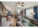 Inviting living room with a large window, comfortable sofas, and access to the kitchen and dining area at 11596 W Sierra Dawn Blvd # 278, Surprise, AZ 85378