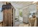 Enclosed porch area with wood storage cabinet and view of the yard at 11596 W Sierra Dawn Blvd # 278, Surprise, AZ 85378