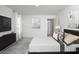 A serene bedroom featuring neutral decor, a comfortable bed, and contemporary artwork at 11725 N Siders Ln, Maricopa, AZ 85139