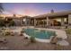 Backyard view featuring a pool, spa, desert landscaping, and covered patio of this luxury home at 12276 N 129Th St, Scottsdale, AZ 85259