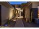 Walkway leading to front door with desert landscaping and landscape lighting at 12276 N 129Th St, Scottsdale, AZ 85259