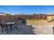 Spacious backyard with gravel, pavers, artificial turf, and a seating area with fire pit at 12344 E Soloman Rd, Gold Canyon, AZ 85118