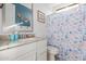 Bright bathroom with a white vanity, granite countertop and a fun, sea-themed shower curtain at 12344 E Soloman Rd, Gold Canyon, AZ 85118