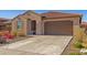 Charming single-story home featuring a tiled roof and a well-maintained desert landscape at 12344 E Soloman Rd, Gold Canyon, AZ 85118