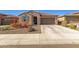Charming single-story home featuring a tiled roof and a well-maintained desert landscape at 12344 E Soloman Rd, Gold Canyon, AZ 85118
