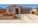 Charming single-story home featuring a tiled roof and a well-maintained desert landscape at 12344 E Soloman Rd, Gold Canyon, AZ 85118
