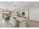 Open concept kitchen with granite island, stainless steel dishwasher, and view to the living room at 12344 E Soloman Rd, Gold Canyon, AZ 85118